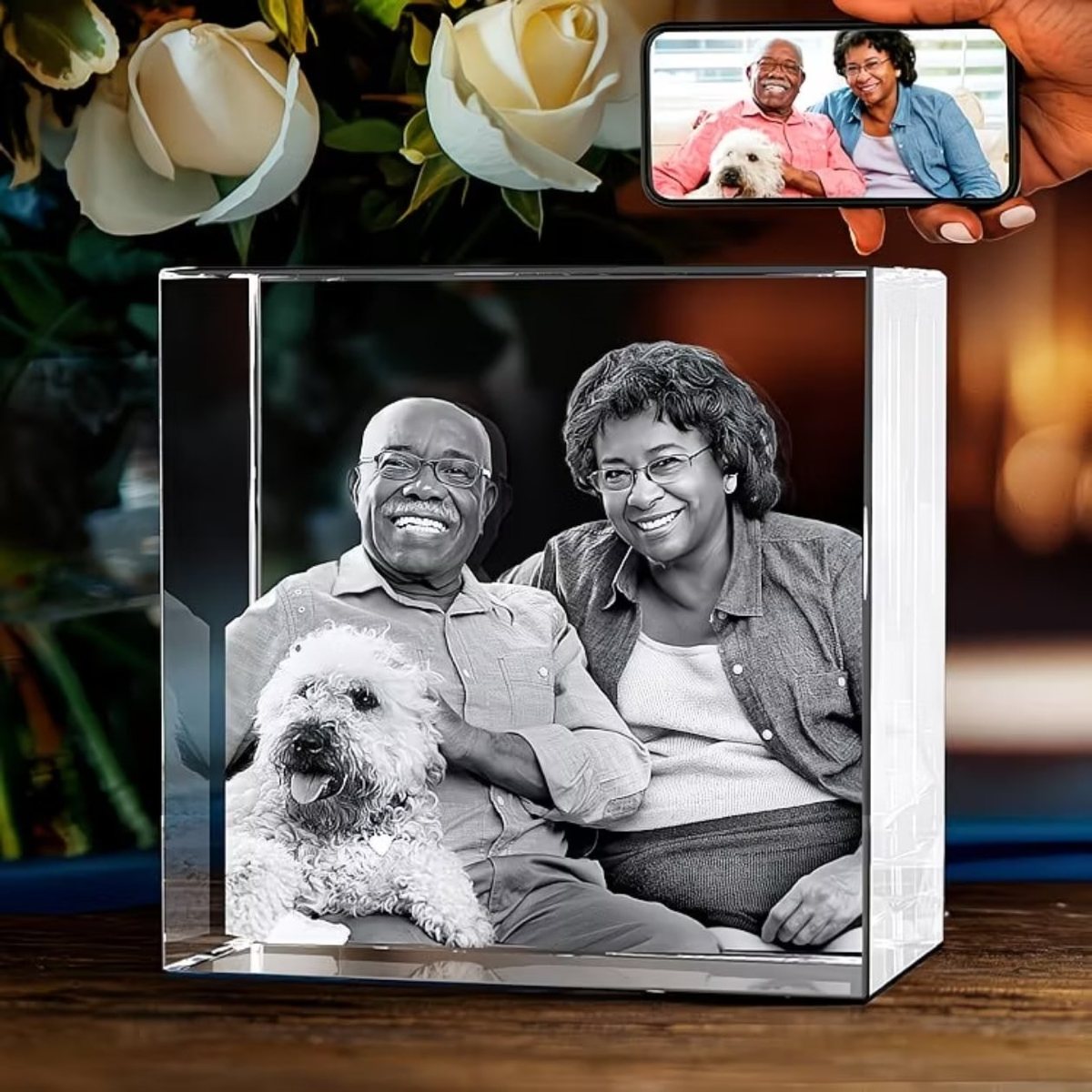 Crystal photo cube of a couple with their dog, with the original photo on a phone