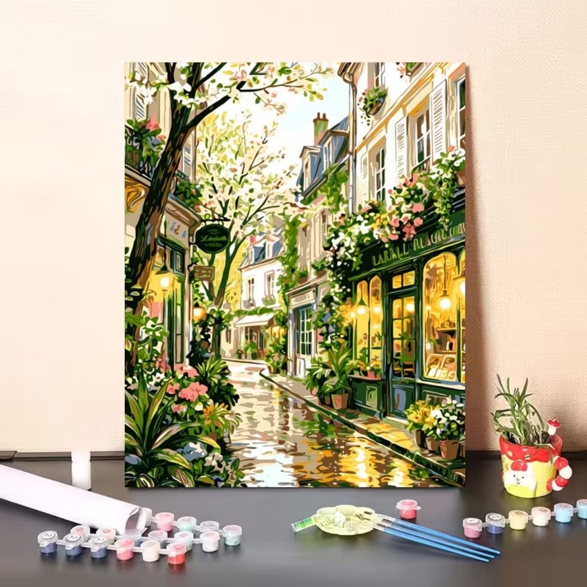 Finished custom paint-by-numbers painting with paints and brushes